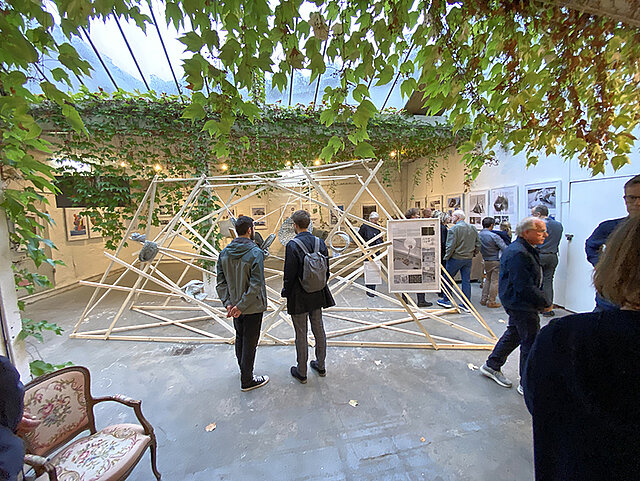 Visitors of the art exhibition looking at a sculpture